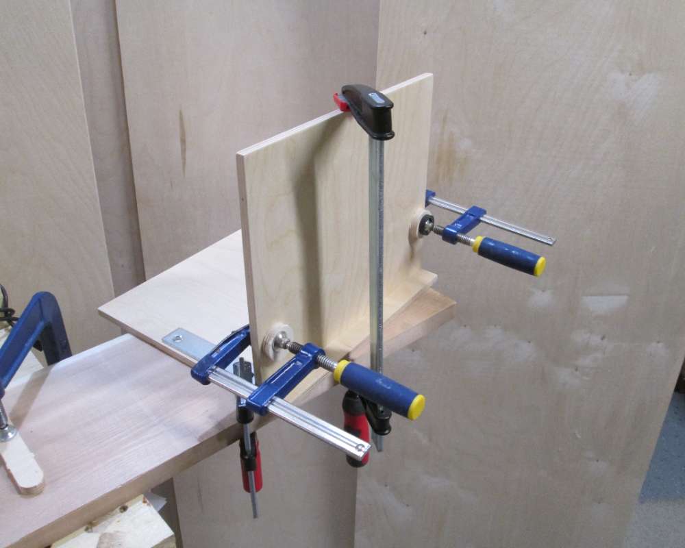 wood boards being glued together to make a modern sloping vinyl record stand