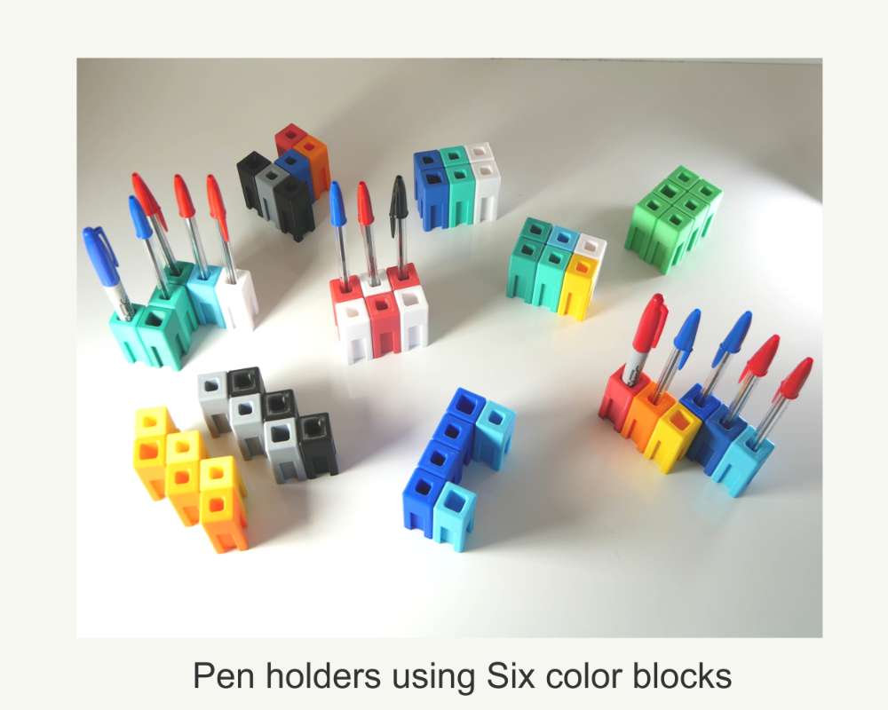 a modular pen holder made from colored plastic blocks that fit together