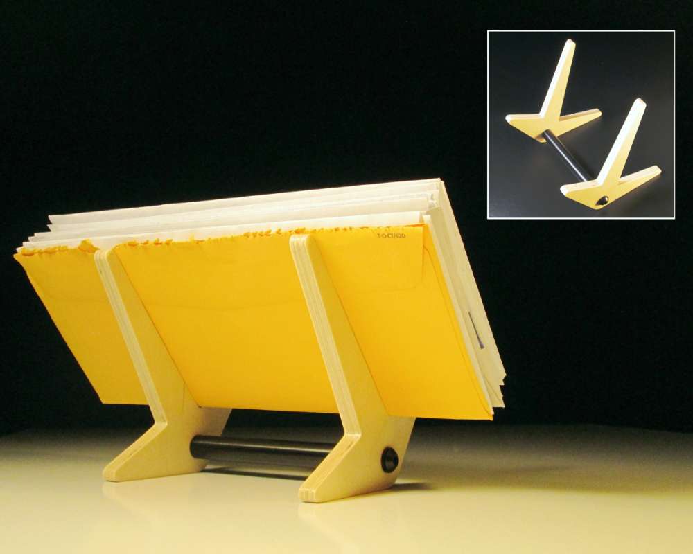 a simple leaning wood stand holding envelopes